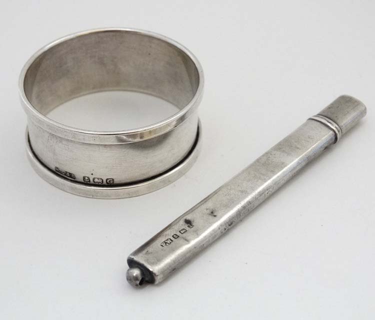 A silver pencil holder hallmarked Birmingham 1910 maker Francis Webb together with a silver napkin