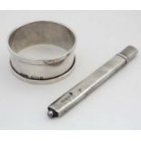 A silver pencil holder hallmarked Birmingham 1910 maker Francis Webb together with a silver napkin