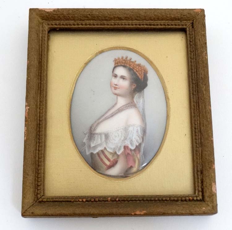 Manner of KPM , A hand painted miniature on oval cabochon porcelain base , depicting a noble lady,