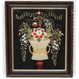 Silkwork : a framed and glazed embroidered image of an urn and flowers,