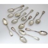 A matched set of 12 silver fiddle thread and shell pattern table spoons : Comprising a set of 6
