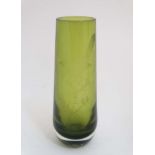 A green glass art vase with etched bird decoration. Indistinctly signed under.