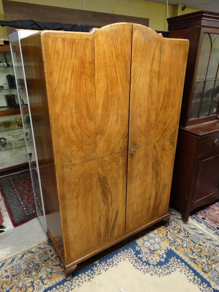 A 1950's Art Deco style quarter veneered 2 door wardrobe 77" high x 47" wide x 19 3/4" deep