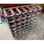 A 42-bottle wine-rack of wood & metal frame construction.