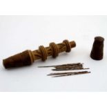 Sewing / Needlework : A Continental turned wooden needle keep of cylindrical form with chip carved