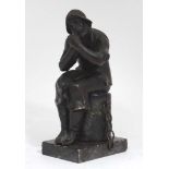 A cast figure upon marble base depicting a seated fisherman lighting a pipe 6" high