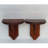 A Pair of mahogany ? wooden clock brackets of supported demi-lune shape ,