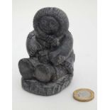 Eskimo soapstone carving of a seated figure CONDITION: Please Note - we do not make