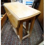 Blonde oak oval drop flap table CONDITION: Please Note - we do not make reference