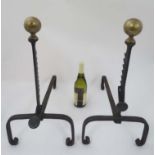 Salvage / Architectural : A pair of cast iron a spherical shaped brass topped Andirons with