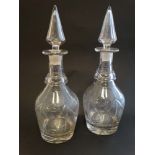 A pair of late 19thC / early 20thC cut glass decanters and stoppers.