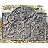 Architectural / Garden Salvage : A cast iron fire back with image of a knight over an armorial