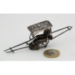 A white metal miniature model of a Sedan Chair. 4"" long CONDITION: Please Note - we do not make