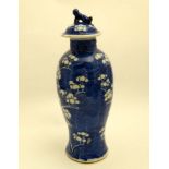 A Chinese blue and white pot and cover, decorated with flowering cherry blossom bough, the cover