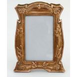Decorative Metalware : An Arts and crafts copper embossed photograph frame with butterflies,