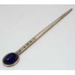 A silver letter opener / paper knife set with amethyst coloured cabochon. Hallmarked Birmingham 1981