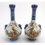 A pair of Chinese twin handled Sauntouping (garlic head) bottle vases, each decorated with birds