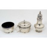 A silver cruet set comprising pepper,