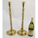 A pair of early 20thC cast brass double open twists tall candlesticks 19" high