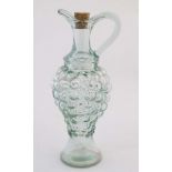 A 20thC pressed glass carafe / claret jug , the body formed as a bunch of grapes,