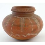 A contemporary Greek style terracotta vase of spherical form similar to a Aryballos, having white