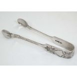 Silver fiddle pattern sugar tongs with engraved decoration. Hallmarked Sheffield 1927 maker Robert