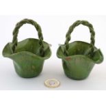 A pair of c1920s Rye Pottery, Sussex green miniature hop baskets having plaited roap handles and