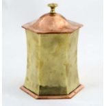 Arts & Crafts decorative metalware : A brass and copper hexagonal pot and cover,