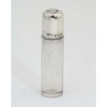 A glass scent / perfume bottle of cylindrical form with spherical glass stopper and silver mounts