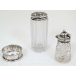 A cut glass dressing table pot with silver top marked 'Sterling' together with a silver mounted