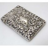 A silver card case with embossed floral and acanthus scroll decoration. Hallmarked Birmingham 1912