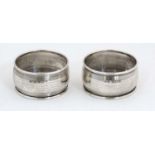 A pair of silver napkin rings hallmarked Birmingham 1927 maker Docker & Burn. (26g) CONDITION: