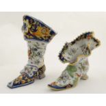 Two French faience Pique-Fleurs / Posy holders formed as boots, each decorated in traditional