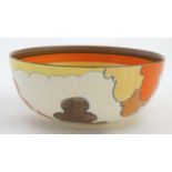 A c1930s Bizarre by Clarice Cliff bowl, in 'Orange Autumn' pattern decorated with trees in a rural