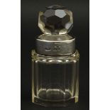 A cut glass jar and stopper with silver collar hallmarked 1904.
