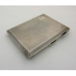 An Art Deco silver cigarette case with engine turned decoration and gilded interior. Hallmarked