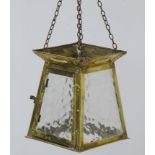 Arts & Crafts : A brass hall lantern with textured glass panels of four sided tapering form.