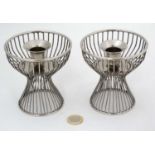 Manner of Warren Platner (1919-2006) American, for Knoll, a pair of silver plated candlesticks ,