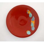 A late 20thC large Poole Pottery charger in Odyssey pattern , having teal and orange decoration on a