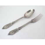 A Victorian silver fork and spoon with engraved foliate decoration Hallmarked Birmingham 1872 maker