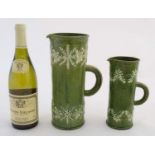 Two c1910 Rye Pottery earthernware ale-jugs decorated in relief with sprigged hops and leaves on a