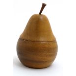 A late 20thC treen turned wood pear shaped caddy marked ' Monkey Pod wood' under 6 3/4" high