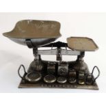 A set of 19thC cast iron Grocers balance scales , having steel pan, weight tray to base,