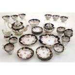 A large 19thC tea service to include teapot, lidded sugar pot, 2 twin handled cake plates,