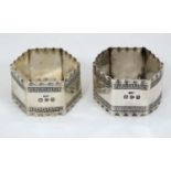 A pair of hexagonal shaped napkin rings with Greek Key decoration hallmarked Chester 1896 maker