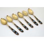 A matched set of 6 Russian silver gilt teaspoons with champlevre like enamel decoration to handles.