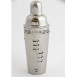 A Stainless Steel cocktail shaker with cocktail recipes to side 10 3/4" high CONDITION: