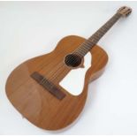 Musical Instruments : A vintage ' Colorado ' acoustic guitar by Eko , Italy .