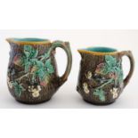 A pair of graduated 19thC Wedgewood Majolica Jugs in Blackberry Bramble Pattern , decorated in