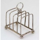 A silver 4 slice toast rack Hallmarked Chester 1916 maker Jay Richard Attenborough Co Ltd. 3""